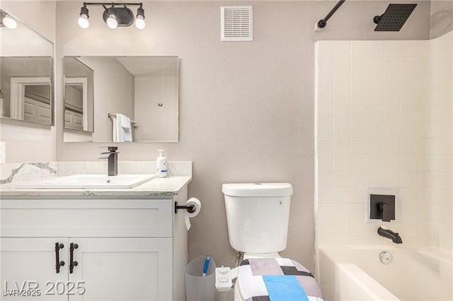 full bath with visible vents, toilet, vanity, and  shower combination