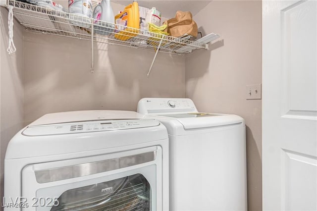 laundry room with washing machine and dryer and laundry area