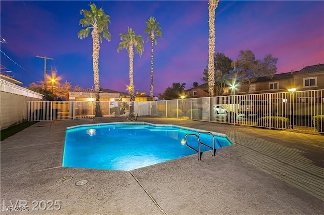 pool featuring a patio area and fence