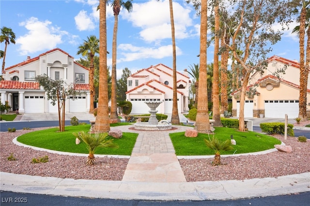 2608 Sun Reef Rd, Las Vegas, NV 89128 - mediterranean / spanish-style home with a front yard, a garage, a tile roof, stucco siding, and driveway