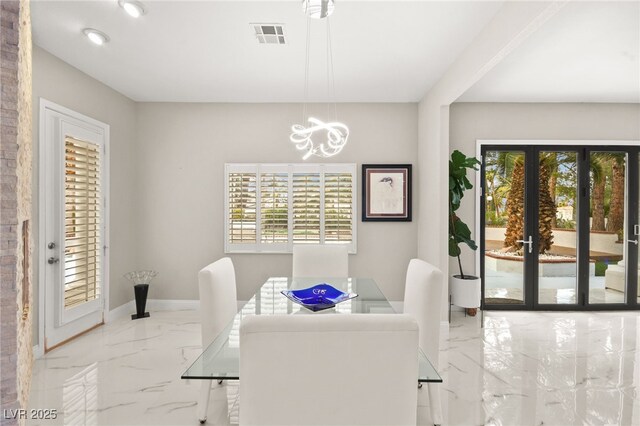 2608 Sun Reef Rd, Las Vegas, NV 89128 - dining area with visible vents, an inviting chandelier, marble finish floor, and plenty of natural light