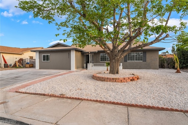 single story home with fence