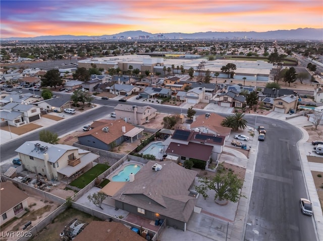birds eye view of property with a mountain view and a residential view