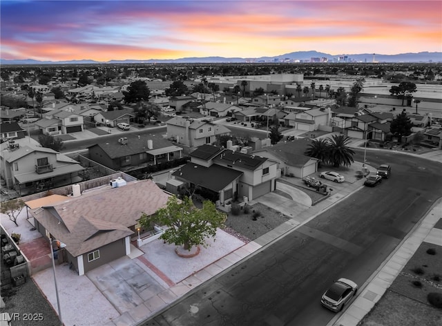 drone / aerial view with a residential view and a mountain view