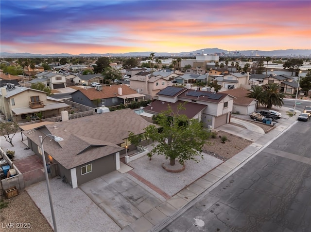 aerial view featuring a mountain view and a residential view