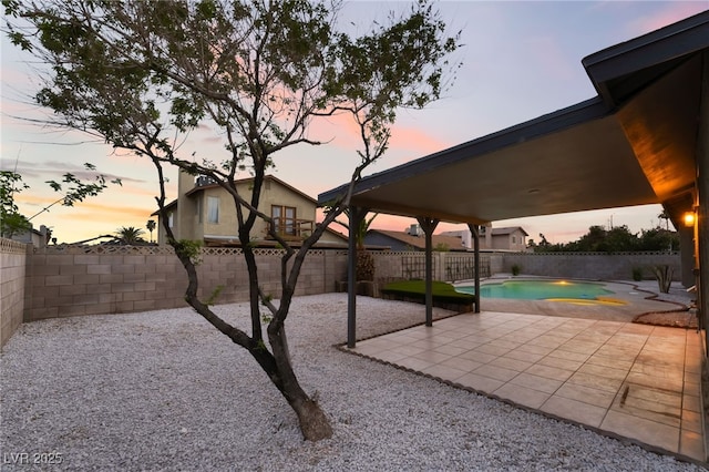 view of patio / terrace featuring a fenced backyard and a fenced in pool