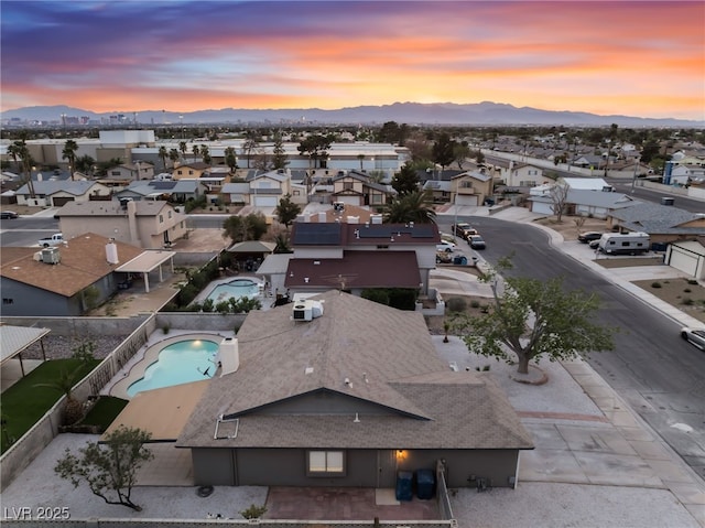 aerial view featuring a mountain view and a residential view