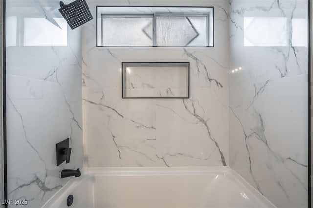 full bath with a healthy amount of sunlight and shower / bathtub combination
