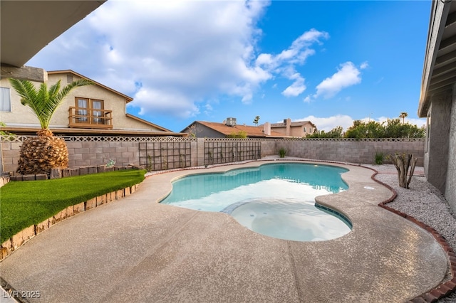view of pool featuring a patio, an in ground hot tub, and a fenced backyard