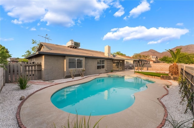 view of pool featuring cooling unit, a fenced backyard, a fenced in pool, and a patio area