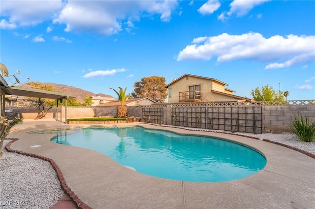 view of swimming pool with a fenced backyard, a fenced in pool, and a patio