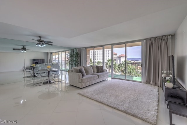 205 E Harmon Ave Unit 803, Las Vegas, NV 89169 - tiled living area with floor to ceiling windows and a ceiling fan