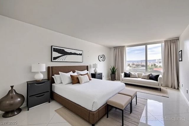 205 E Harmon Ave Unit 803, Las Vegas, NV 89169 - bedroom with light tile patterned floors and baseboards