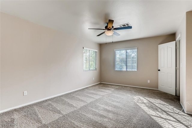interior space featuring carpet, visible vents, baseboards, and ceiling fan