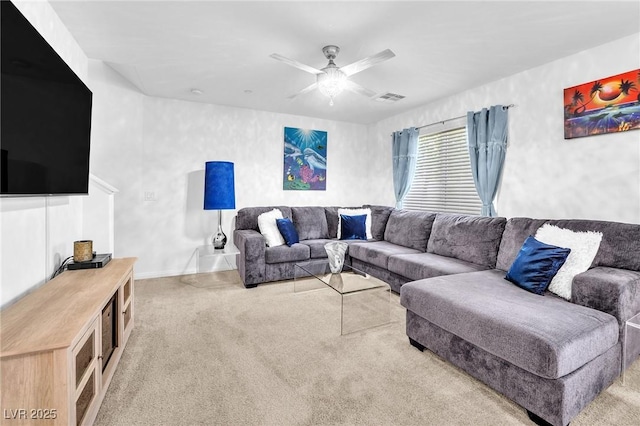 living room with baseboards, visible vents, a ceiling fan, and light colored carpet