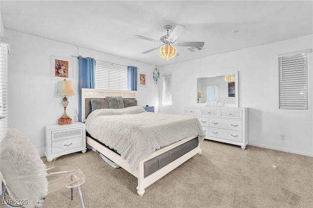 bedroom with carpet flooring, baseboards, visible vents, and ceiling fan