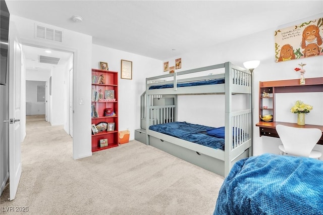 carpeted bedroom featuring visible vents