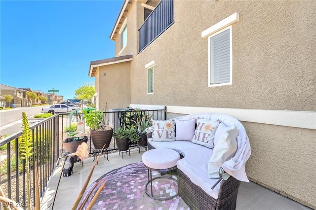 balcony with an outdoor hangout area