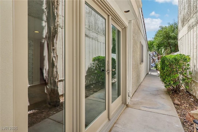 doorway with unfinished concrete flooring