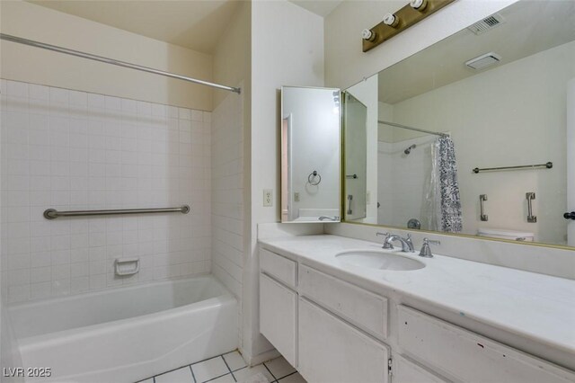 bathroom featuring vanity, tile patterned flooring, shower / bath combo with shower curtain, and visible vents