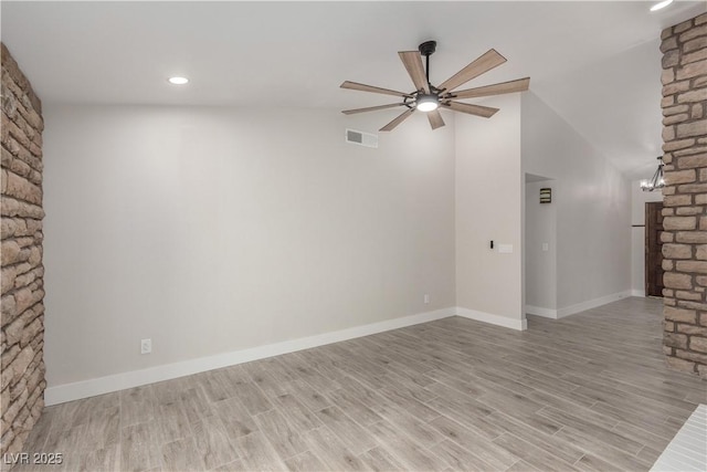 unfurnished living room featuring visible vents, ceiling fan, light wood-type flooring, and baseboards