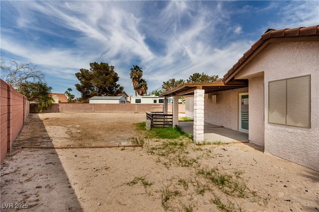 view of yard with a patio area and a fenced backyard