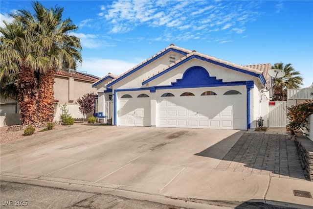 182 Horizon View Dr, Henderson, NV 89015 - view of front of house featuring an attached garage, concrete driveway, stucco siding, and a tiled roof