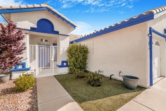 182 Horizon View Dr, Henderson, NV 89015 - property entrance with stucco siding and a tile roof