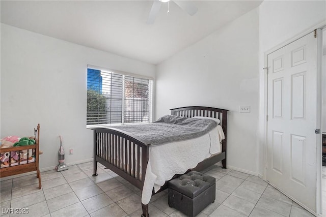 182 Horizon View Dr, Henderson, NV 89015 - bedroom featuring light tile patterned floors, vaulted ceiling, baseboards, and a ceiling fan