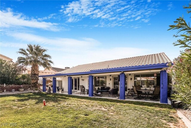 182 Horizon View Dr, Henderson, NV 89015 - back of property with stucco siding, a patio area, a tiled roof, and a lawn