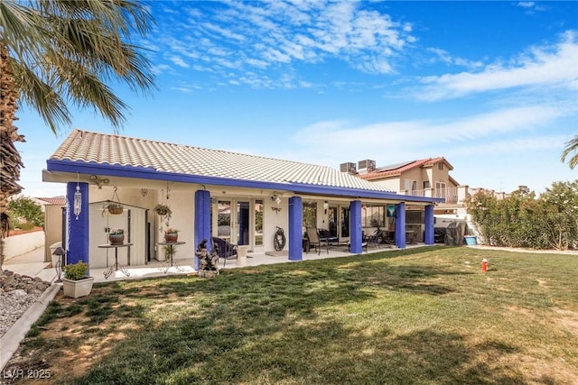 182 Horizon View Dr, Henderson, NV 89015 - rear view of property with a tiled roof, stucco siding, a chimney, a lawn, and a patio area