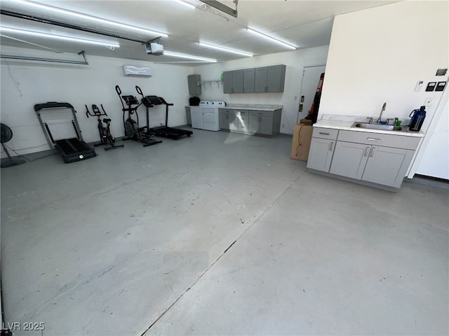 1410 E Serene Ave, Las Vegas, NV 89123 - garage featuring a garage door opener, washing machine and clothes dryer, electric panel, and a sink
