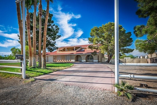 1410 E Serene Ave, Las Vegas, NV 89123 - mediterranean / spanish house featuring driveway and fence