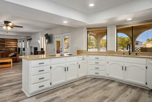 1410 E Serene Ave, Las Vegas, NV 89123 - kitchen featuring a peninsula, plenty of natural light, a ceiling fan, light wood-style flooring, and recessed lighting