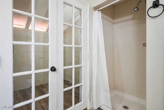 1410 E Serene Ave, Las Vegas, NV 89123 - bathroom featuring a tile shower and french doors