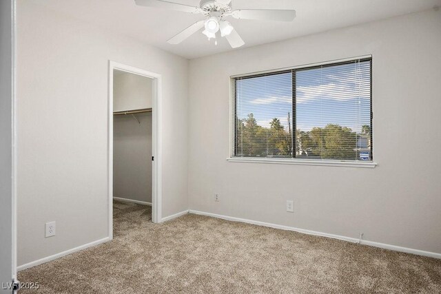 1410 E Serene Ave, Las Vegas, NV 89123 - unfurnished bedroom featuring baseboards, carpet floors, a closet, ceiling fan, and a walk in closet