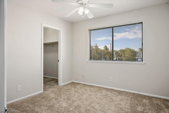 1410 E Serene Ave, Las Vegas, NV 89123 - unfurnished bedroom featuring carpet, a walk in closet, a closet, and ceiling fan