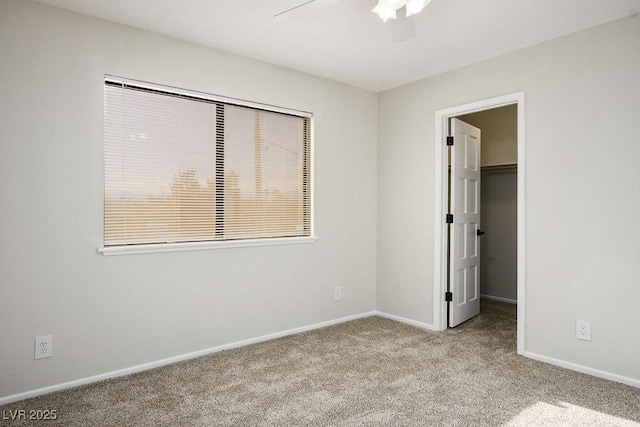 1410 E Serene Ave, Las Vegas, NV 89123 - unfurnished bedroom with carpet floors, a walk in closet, ceiling fan, and a closet