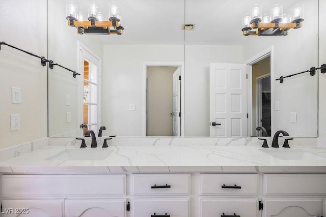 1410 E Serene Ave, Las Vegas, NV 89123 - full bathroom with an inviting chandelier, a sink, and double vanity