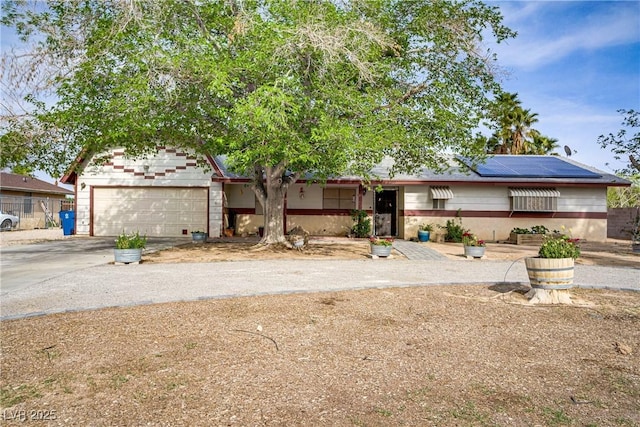 3100 Garehime St, Las Vegas, NV 89108 - ranch-style house featuring concrete driveway, an attached garage, and solar panels