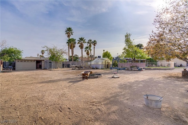3100 Garehime St, Las Vegas, NV 89108 - view of yard with an outdoor structure and a greenhouse