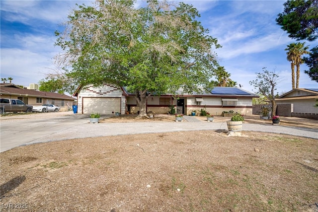 3100 Garehime St, Las Vegas, NV 89108 - view of front facade featuring concrete driveway and roof mounted solar panels