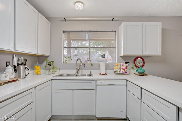 3100 Garehime St, Las Vegas, NV 89108 - kitchen featuring dishwasher, a sink, white cabinetry, and light countertops