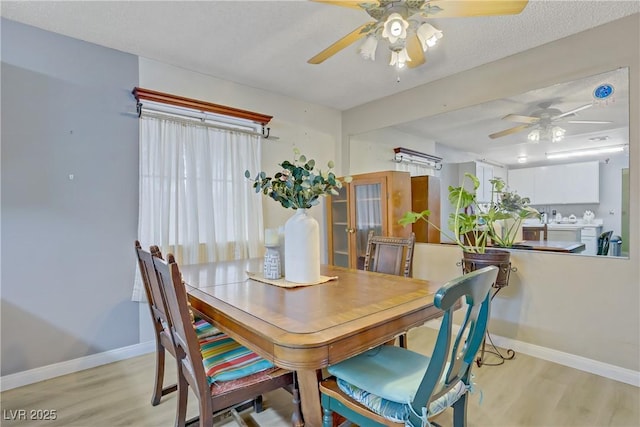 3100 Garehime St, Las Vegas, NV 89108 - dining area with ceiling fan, light wood-style floors, and baseboards