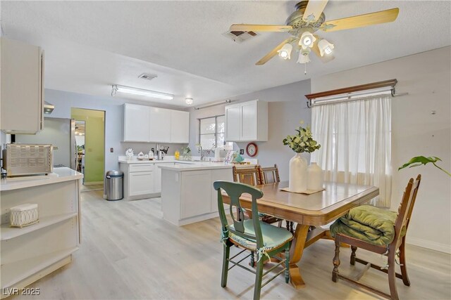 3100 Garehime St, Las Vegas, NV 89108 - dining room featuring light wood-style floors and a ceiling fan