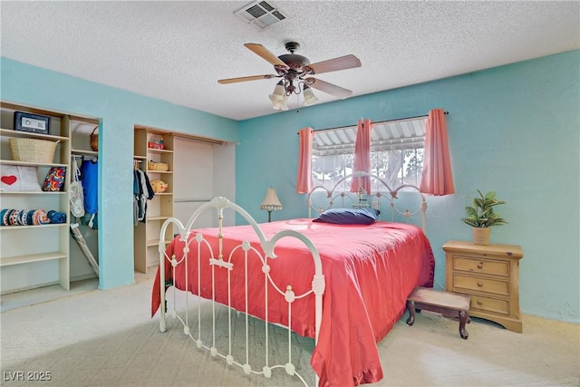 3100 Garehime St, Las Vegas, NV 89108 - carpeted bedroom with a textured ceiling, multiple closets, and ceiling fan