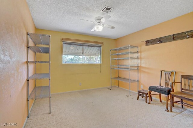 3100 Garehime St, Las Vegas, NV 89108 - sitting room featuring ceiling fan, carpet floors, and a textured ceiling
