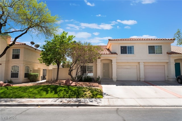 7945 Delbonita Ave, Las Vegas, NV 89147 - mediterranean / spanish house with a tiled roof, stucco siding, fence, an attached garage, and concrete driveway