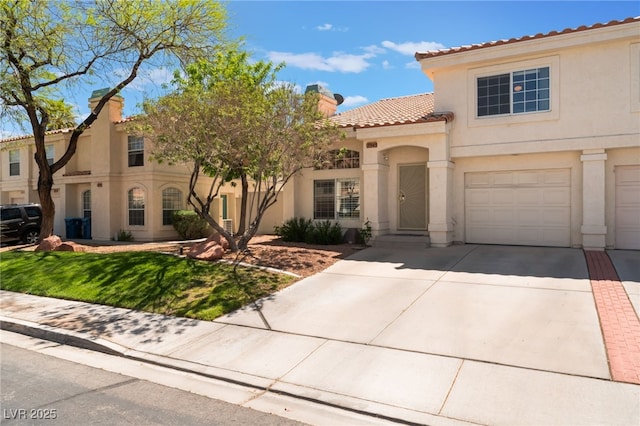 7945 Delbonita Ave, Las Vegas, NV 89147 - mediterranean / spanish house featuring stucco siding, a chimney, driveway, an attached garage, and a tile roof