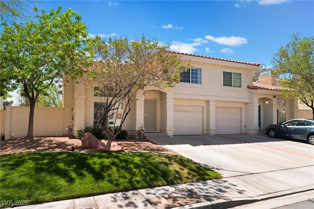 7945 Delbonita Ave, Las Vegas, NV 89147 - mediterranean / spanish-style home featuring an attached garage, concrete driveway, stucco siding, and fence